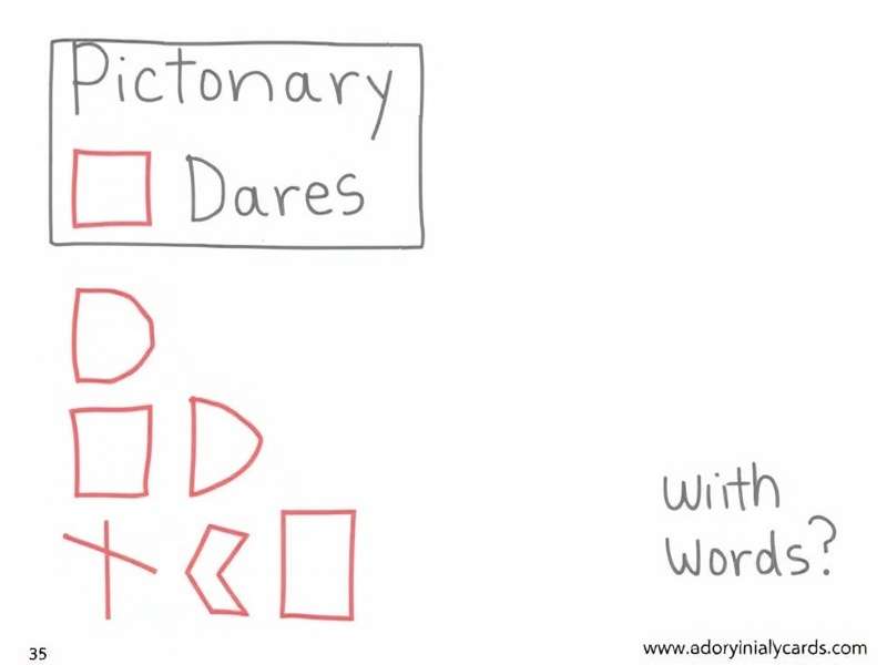 Colorful Pictionary cards and drawing materials spread on a table